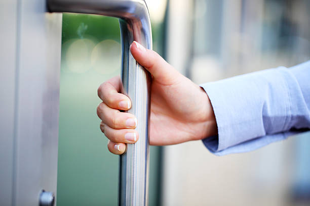 istock Close up of human hand open the door. 186849265