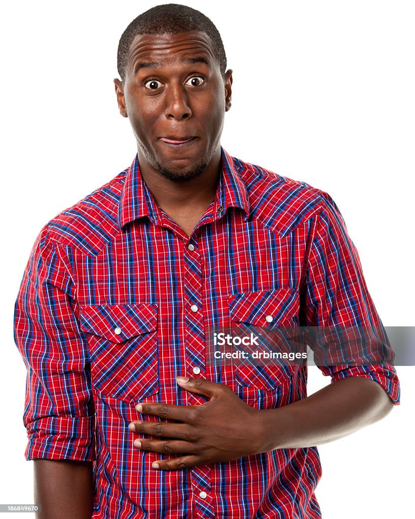 Excited Hungry Man Rubs Stomach Portrait of a man on a white background. Men Stock Photo