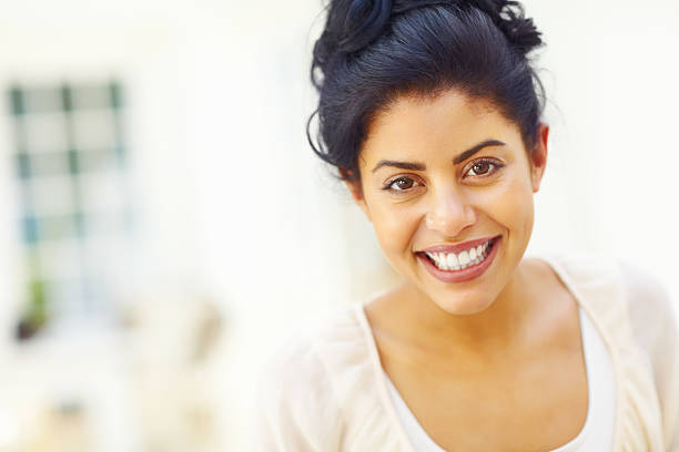 istock Young woman with a warm smile 186849936