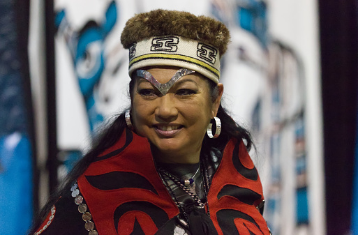The Nisga'a Nation Hobiyee festival celebrated in Vancouver, Canada on 6 February 2015. The celebration commemorates the Nisga'a Nation's lunar new year. The Nisga'a gathering is powerful with the beating of drums, dance and beautifully intricate regalia. Beautiful First Nations woman in her regalia.