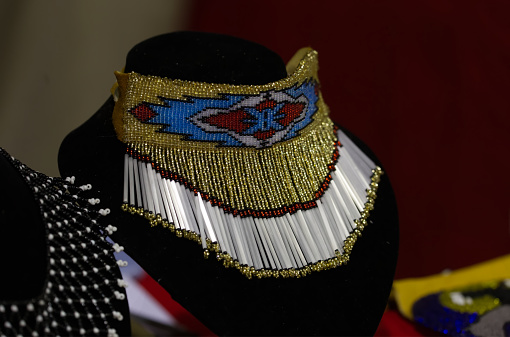 The Nisga'a Nation Hobiyee festival celebrated in Vancouver, Canada on 6 February 2015. The celebration commemorates the Nisga'a Nation's lunar new year. The Nisga'a gathering is powerful with the beating of drums, dance and beautifully intricate regalia. An example of beautiful bead work for sale.