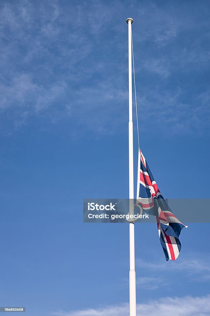 British Union Flag at Half-mast A British Union Flag flying at half mast. British Flag Stock Photo