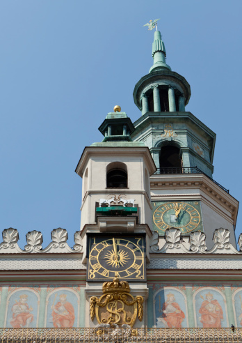 A close up on a tower of Poznan Renaissance Town Hall where two mechanical goats are butt heading everyday at noon above the clock. It's one of Poznan tourists attraction.