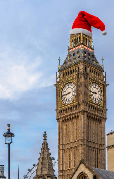 Christmas view of Big ben in the hat Christmas view of Big ben in the hat, UK big ben stock pictures, royalty-free photos & images