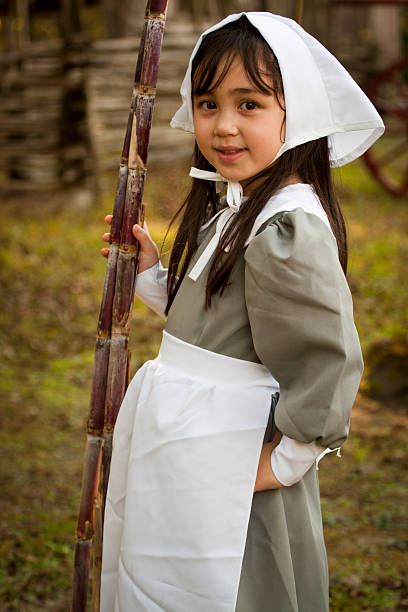 Young woman posing in a period costume in a medieval castle. About 25 years old, Caucasian brunette.