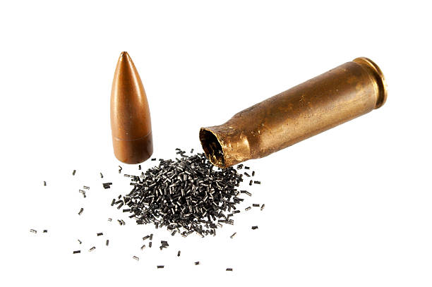 istock Opened brass colored bullet showing the black gun powder 186852031
