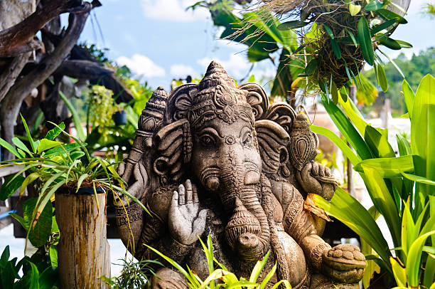Ganesha Statue of the Hindu God Ganesha in a tropical environmentOther: ganesha god thailand india stock pictures, royalty-free photos & images