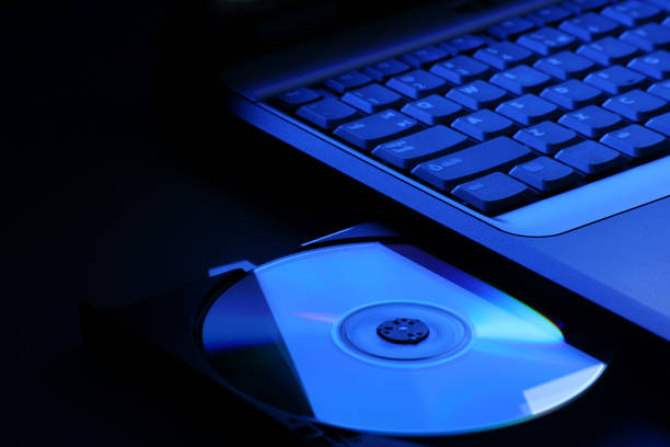 Laptop with open dvd drive stock photo