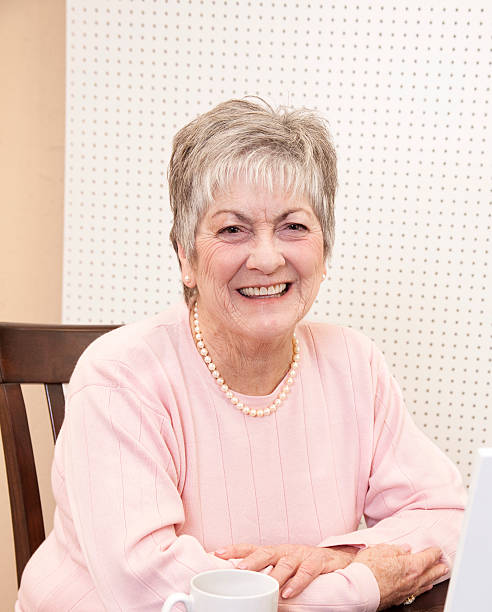 istock Senior woman looking at camera smiling 186852957
