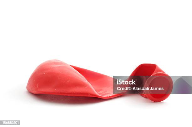 Deflated Red Balloon Stock Photo - Download Image Now - Balloon, Deflated, Red