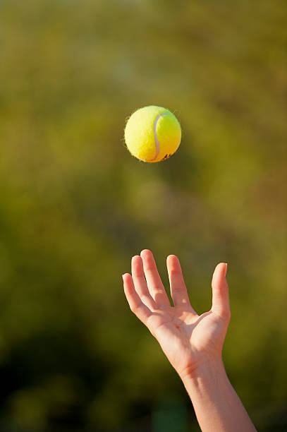 istock Throwing the tennis ball for serving 186853588