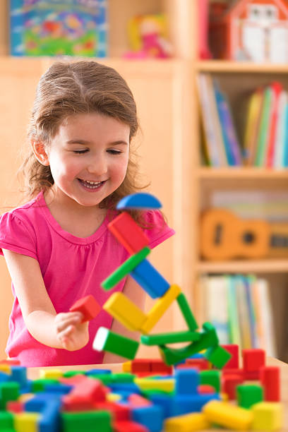 istock Little girl with wood blocks 186853749