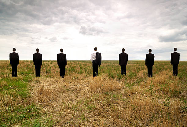 istock Businessman in a line of seven 186853897