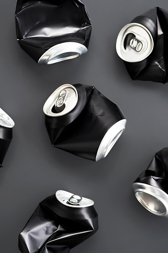 Crumpled aluminum soda cans still life.