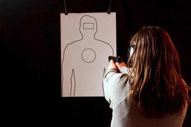 istock Young Female Shooter - No Bullet Holes 186854618