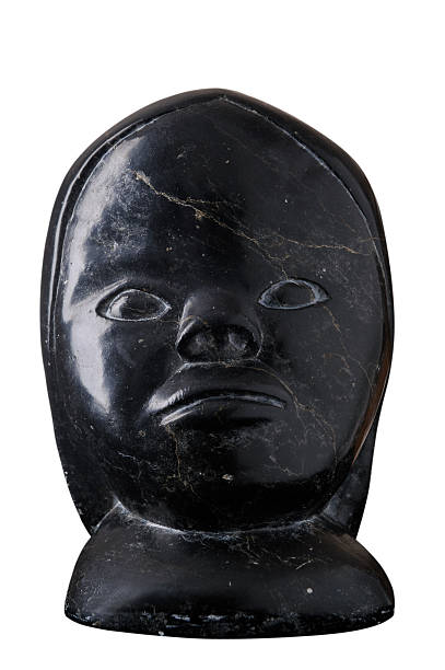 Studio shot of traditional soapstone Inuit art. Black stone.