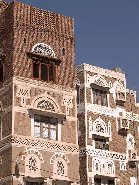 Beautiful  house in old city in Sanaa with new floor for younger generation in the evening.  High angle view. Yemen.