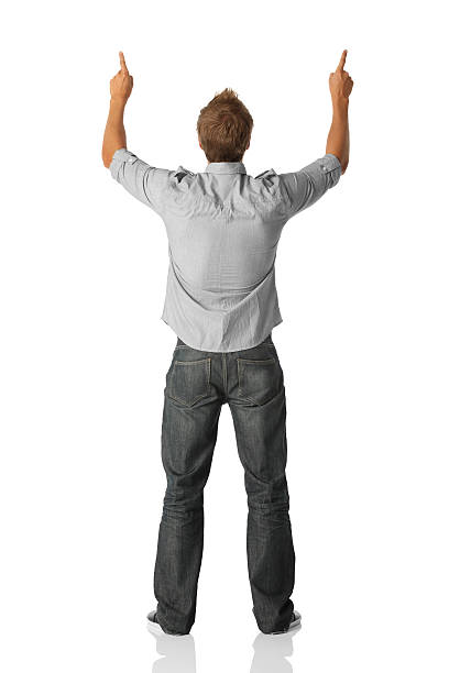 istock Rear view of a man standing with fingers raised 186855377