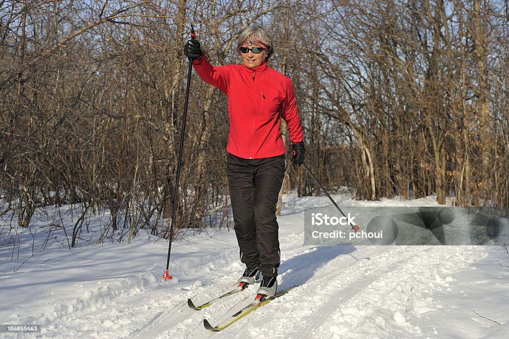 Woman, cross-country skiing, winter sport Woman skiing on a beautiful day. 30-39 Years Stock Photo