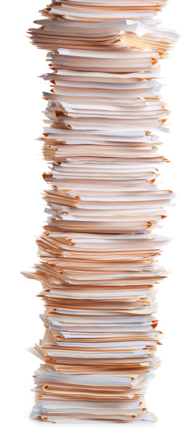 This is a photo of a tall stack of folders with papers inside on a white background.Click on the links below to view lightboxes.