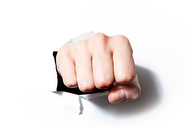 istock Paper broken by the fist 186856250