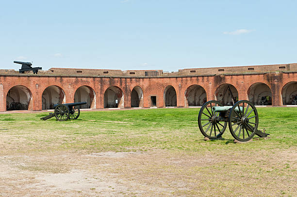 The muzzle of an old gun dating back to the middle ages. The gun stands on a gun carriage on a part of the old city wall next to the river IJssel in the town of Zutphen in The Netherlands