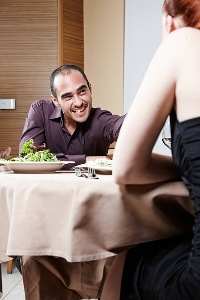 istock Attractive young couple at restaurant table 186857778