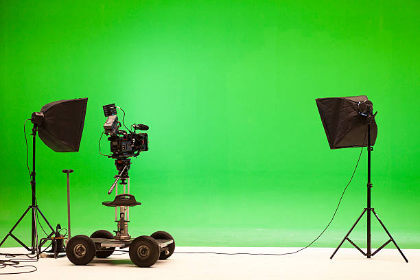 Greenscreen studio setup Professional digital camera at a chroma key studio setup. film studio stock pictures, royalty-free photos & images