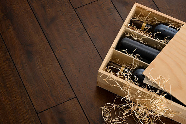 istock Opened wooden wine box packed with wine and straw 186858467