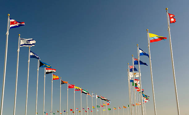 World flags on display bellow the blue sky Flags representing many countries. unicef photos stock pictures, royalty-free photos & images