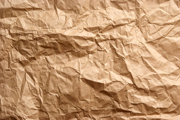 brun texture d'arrière-plan de papier froissé - brown paper paper crushed wrinkled photos et images de collection