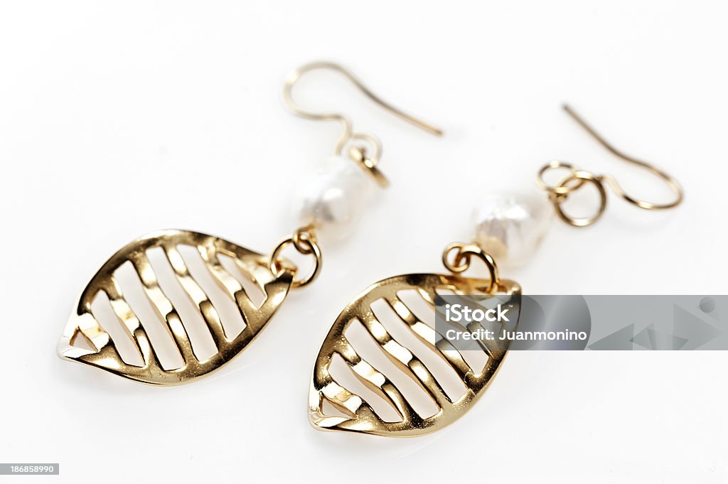 Zwei Gold Earings - Lizenzfrei Ohrring Stock-Foto