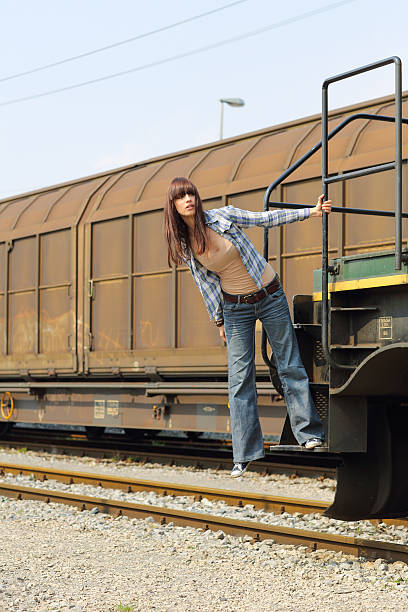 istock Pretty girl on a freight train 186859241