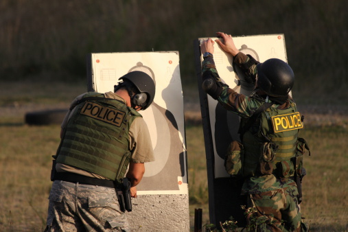 Two Officers put up targets for training.