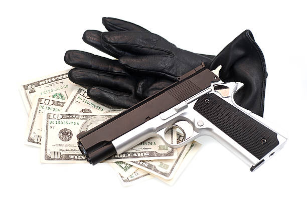 istock stolen goods gun gloves and dollars 186859333