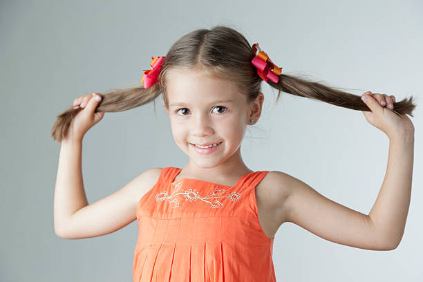 istock Cute little girl with pony tails 186859535