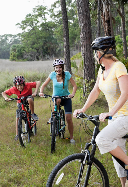 istock Mother with children riding bicycles 186859687