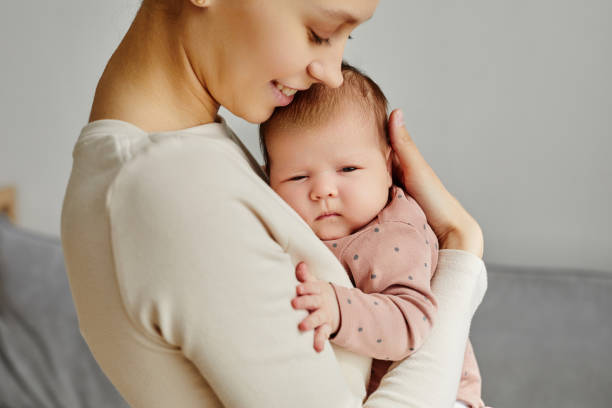 istock Loving Mother Hugging Baby 1868598605