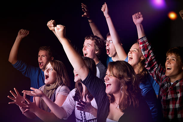 istock Teens celebrating at a concert or event 186859875