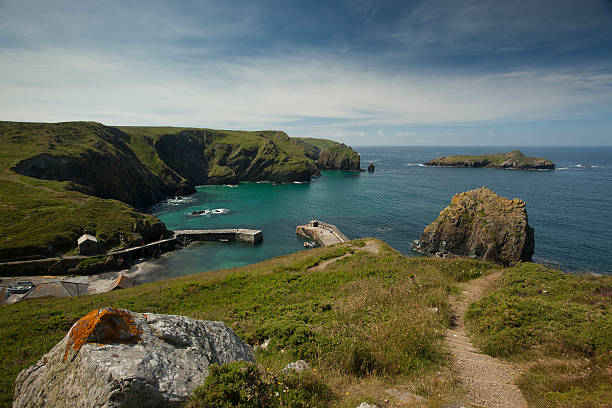 Mullion Cove "The view from the coastal path of Mullion cove, Lizard Peninsular, Cornwall, U.K" mullion cove stock pictures, royalty-free photos & images