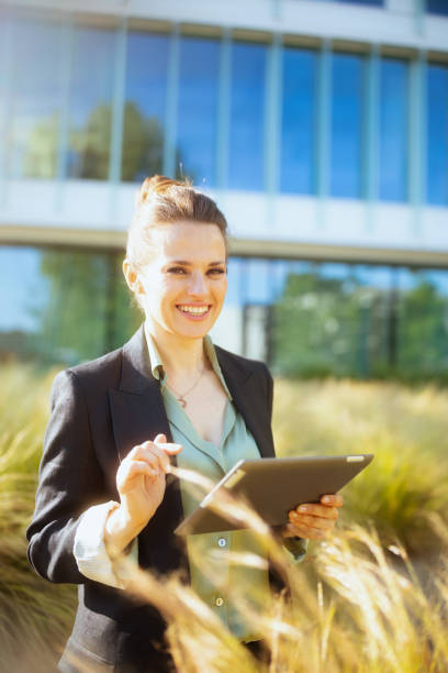 istock smiling modern female employee in business district 1868603045