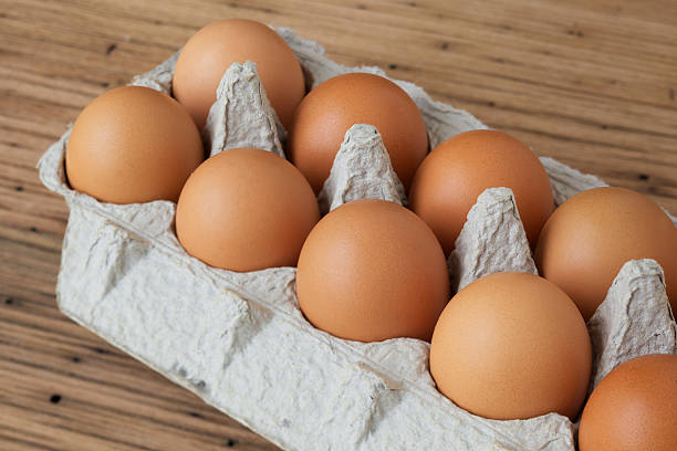 istock Brown eggs in cardboard carton 186861223