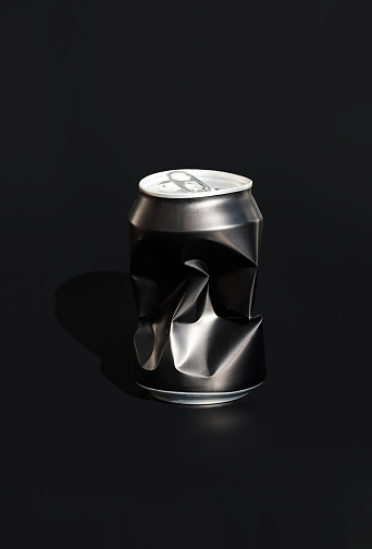 One aluminum creased drinking can. Sorting garbage concept.