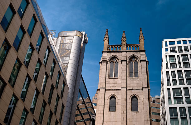 istock Church hemmed in by modern office buildings 186861624