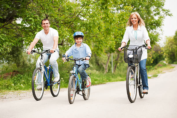 Happy family riding bikes.