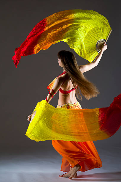 istock Belly dancer with colorful Fan Veils 186862259