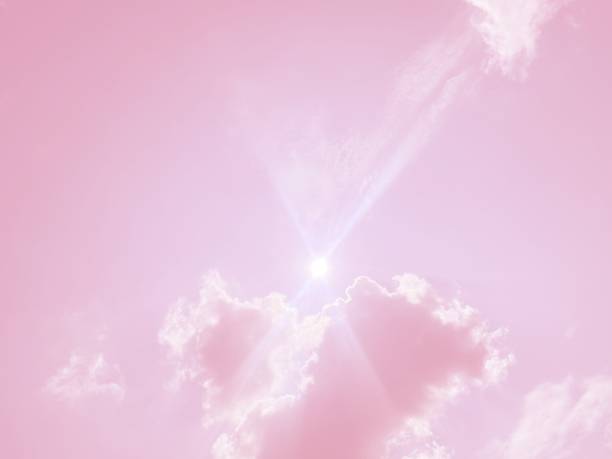 istock Sun shines through soft pink clouds in the sky 1868626271