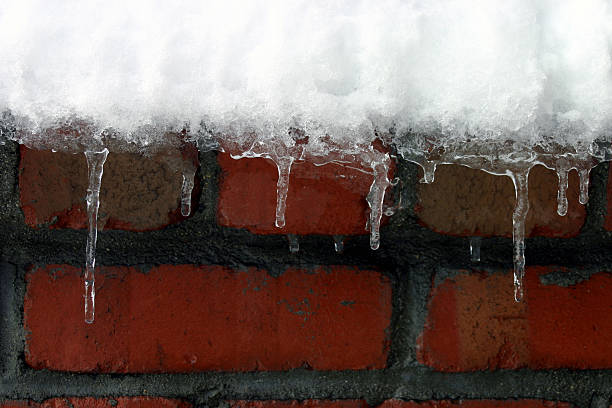 icycle at chimney brick masonry : winter snow