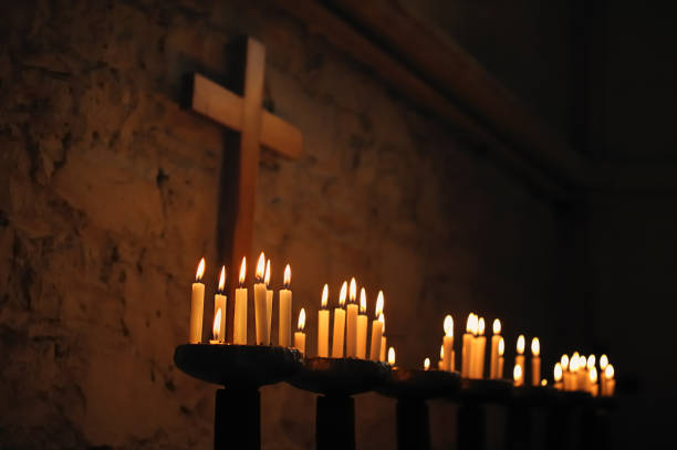 Prayer Candles with Religious Cross stock photo