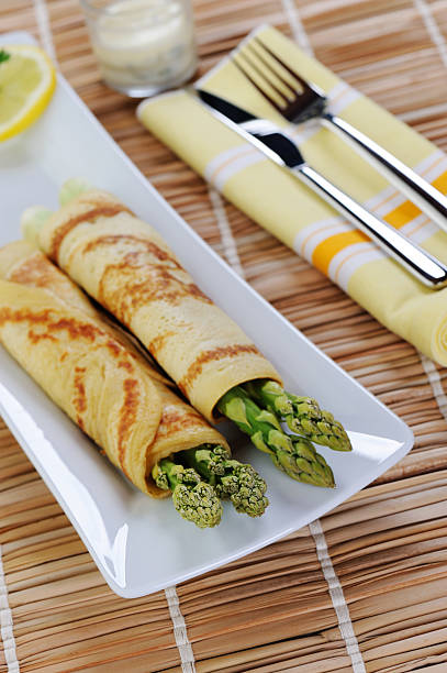 istock Green Aspargus Wrapped in Pan Cake 186862924